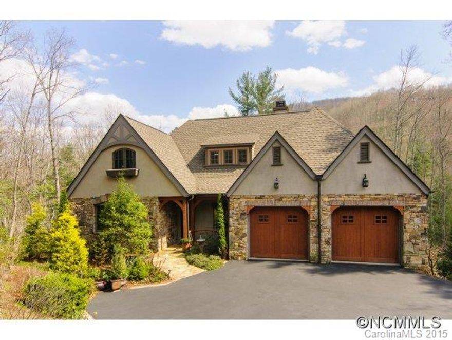 The Millstream, one of Walnut Cove's most popular enclaves, marries low maintenance with timeless European style. A suite-on-suite master flows easily to the great room. The huge screened deck offers a wood burning fireplace and year-round outdoor living. From here enjoy the soothing sound of Powder Creek, which borders this level 1.3 acre property. Walnut Cove's nature trail system meanders along the stream and is but a few steps from your home.