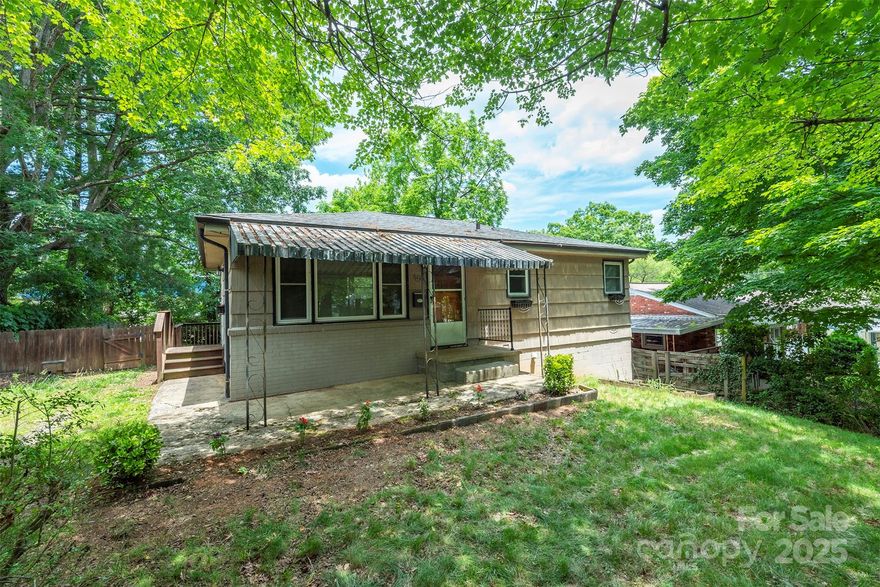 Neat as a pin one-level cottage on full basement and huge level yard, less than 10 minutes to Downtown Asheville and walkable to restaurants and grocery store. Hardwood and tile floors throughout. Smart floor plan makes good use of all space. Covered front porch as well as back deck overlooking the huge fenced back yard, surrounded by mature trees for privacy. Ideal for starting out or downsizing, this home is at a hard to find price point!