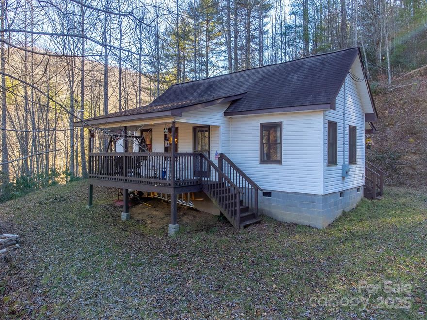 Privately tucked away on over 4.5 acres of unrestricted land, this lovingly cared for 2 bedroom, 2 bath home offers the perfect mountain retreat. If you are looking to escape the hustle and bustle of the city and enjoy peace, privacy, and room to roam while remaining conveniently close to the towns of Sylva and Franklin, this home may be the perfect fit. Outdoor adventure is right at your doorstep with nearby hiking and mountain biking trails, trout fishing, gem mining, and easy access to the Great Smokies National Park. You'll love spending days on the front porch, taking in the sounds of the nearby creek or playing corn hole in the yard. This home is being sold mostly furnished with just minor exceptions.