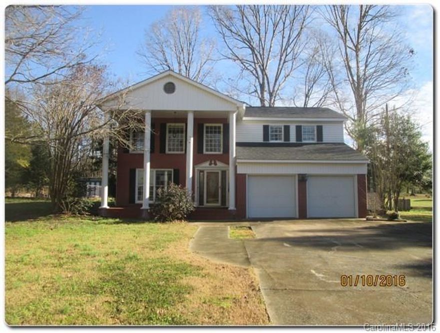 Southern Charmer in Marshville! Great curb appeal with home, covered front porch has large columns, expansive concrete parking pad in front of 2 car garage. Home sits on almost 2 acres of land with in-ground swimming pool. Spacious rooms with plenty of options to add your personal touches. 2 Large brick fireplaces in home make multiple rooms great for entertaining.