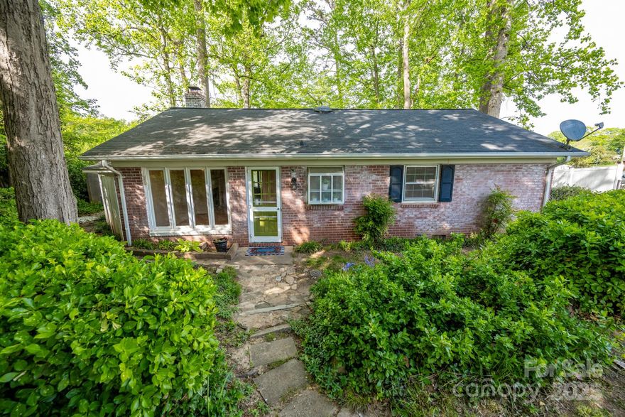 This LAKE NORMAN home in the highly desirable Westport community is waiting for you! Situated on a cul de sac lot with over 143 Ft of WATER FRONTAGE on a year round, deep water cove and in close proximity to the main water channel & Governor's Island.  This 1 story home has 2 bedrooms + a den/flex room, wood burning fireplace in the living room & walk through kitchen.  The large screened-in back porch has gorgeous views of mature Azaleas on a gently sloping lot that leads to your private pier and dock.  The large cove allows plenty space for boaters, paddle boarding or floating on your favorite lake mat.  A shed and outdoor storage room offer additional space for gardening equipment and lake toys.  Lot connected to county water/sewer.  Heat pump replaced in '20.  The AC, H2O heater & roof were replaced in last 10/12 years.  Westport Golf Club & Westport Swim/Tennis Club offer memberships.  Make your dream of Lake Living happen today!