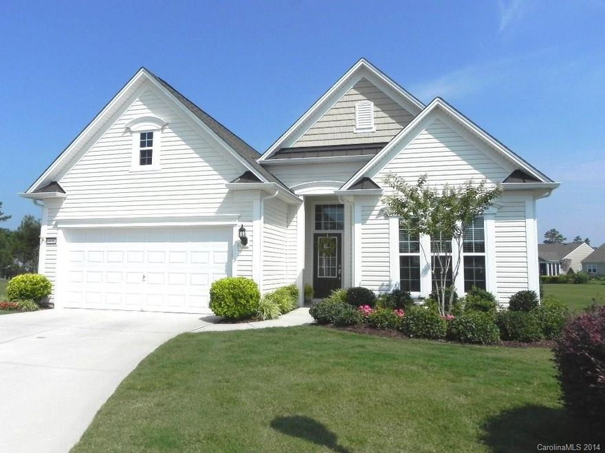 This 2BR/2BA home features an office, sunroom & private deck w/automatic awning. It has granite counters, tile backsplash, black GE appliances & gas stove, wood flooring in foyer, great room & kitchen, ceramic tile in the baths & laundry, ceiling fans, upgraded light fixtures & much more. It sits on a cul-de-sac lot w/irrigation & spacious view. Come check out this home & the active adult lifestyle of Sun City Carolina Lakes.