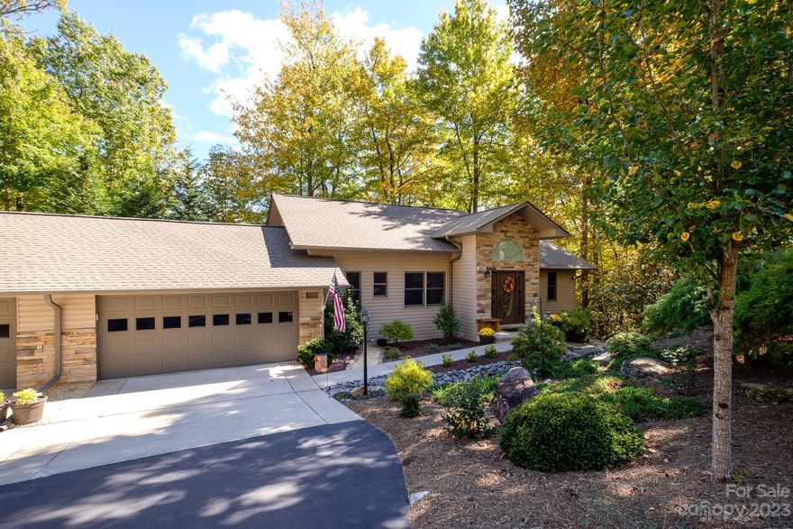 This 3 bedroom, 2.5 bath is a highly sought after, updated unit in Qualla Village. It sits nested in the trees only steps away from the flowing ponds leading to Lake Ticoa. Interior features include hardwood floors, quartz counter tops and matching appliances. The master bedroom is on the main floor and the living room features vaulted ceilings and a large stone fireplace with a new electric insert. Downstairs you will find two bedrooms and a large family room with a wet bar. The downstairs patio was recently fenced for pets. In Connestee you will find over 20 miles of pristine hiking trails, 6 waterfalls, 4 lakes totaling over 230 acres of lake frontage, an 18 hole designer golf golf course, pickle ball, tennis, pool facilities and multiple top notch food and beverage options. In addition residents of Qualla village enjoy private lake access with 2 boat docks, community water craft, and the association provides scheduled maintenance services for decks driveways and home exteriors.