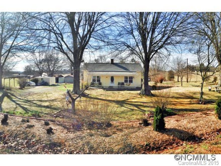 1901 Farmhouse w/ rural setting, 2 usable acres perfect for gardening & horses, cattle, etc (unrestricted). Move-in-ready w/ lots of updates in recent years (Heat Pump (07/15) vinyl windows, new roof, new paint in & out, new plumbing fixtures & lighting fixtures, flooring, brand new Stainless fridge & the list goes on & on. LR + Den w/ wood stove. 3 storage buildings + old pole barn & covered carport area, public water + well. This home is a GEM