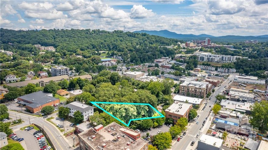 One of the biggest vacant lots left in Downtown Asheville! This lot in Asheville's booming South Slope is over .5 acres in an opportunity zone and features stellar views off the back.  Approved for 48-54 units, the current owners were exploring going a bit larger with parking. Zoned CBD for a multitude of uses. See attached plans for info. Multifamily, office, retail, come do it!