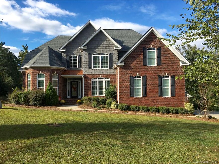 Gorgeous custom built home with tons of living space. Third level of home has been studded, wired and sheet-rocked. Large master on main, dining room w/coffered ceilings. Granite kitchen w/work island, double oven and breakfast bar. Office on main level. Attached double garage and a detached double garage.