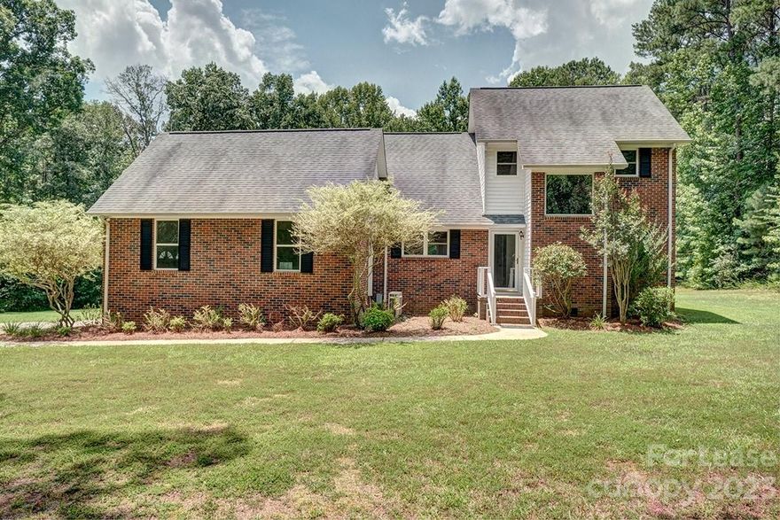 Rental in Clover school district ! Spacious home with almost 2 acres of room to run. This 3 bedroom 2.5 bath home with bonus room is move in ready. New paint, LPV flooring and carpet throughout. Sheds to remain. Very private lot and great area.   2 car garage and carport for parking. Refrigerator and washer and dryer to remain.  Application attached and minimum 1 year lease.