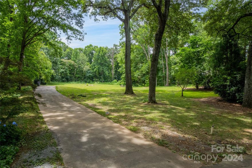 Build your custom home on this expansive 1.531 acre lot in Town & Country Estates! Previous home and all debris has been cleared and lot has been maintained. Backing up to Carmel Road Park and surrounded by trees, this is a rare opportunity to build on an extremely private lot while having the convenience of an in-town location!