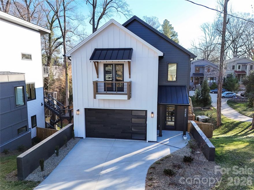 Your luxury new build awaits in this customized residence, featuring a rare full walk-out basement. Step through the dramatic two-story foyer into light-filled entertaining spaces framed by walls of windows. The kitchen is a true showpiece, with custom cabinetry to the ceiling, quartz countertops, a professional-grade built-in refrigerator/freezer, and a 36-inch gas range with commercial vent hood. It flows seamlessly into the living room with gas fireplace and built-ins, as well as the dining area. A main-level drop zone, powder room, and generously sized two-car garage add everyday convenience. Upstairs, you’ll find three bedrooms, including one with a Juliet balcony and a shared Jack-and-Jill bath. The primary suite spans the back of the home, complete with a vaulted ceiling and sliding doors to a private deck. Enjoy a custom walk-in closet and a spa-inspired bath with dual vanity and private water closet. The daylight basement offers exceptional versatility, featuring a spacious second living area with wet bar and wine fridge, an additional bedroom and full bath, walk-in storage, and doors opening to yet another deck, one of three across the rear of the home. This high-end home perfectly marries function and design, all backed by a full new-construction warranty. Ideally located in booming Oakhurst, just around the corner from dining, coffee, fitness, and more. Welcome home.