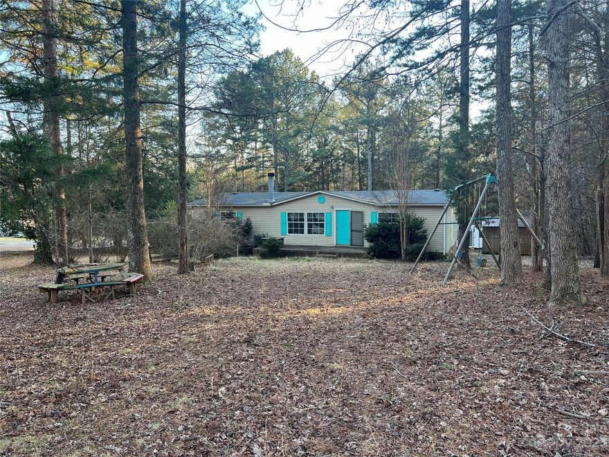 Hard to find Davidson home on 1 acre of land! 3 bedroom 2 bath home on corner lot in Davidson but with lower Cabarrus county taxes. This home is perfect for the handy person that wants to put their own touch on it. Home will need repairs and being sold as is. 
HVAC replaced in 2018. 3 outbuildings with power to convey. Agents read agent remarks in mls.