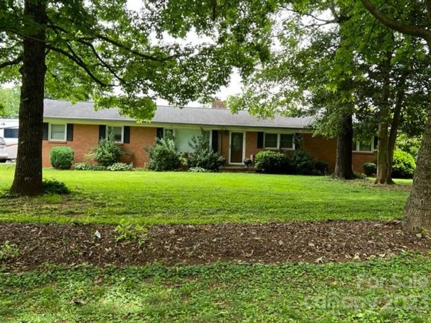 Brick home with 3 bedroom and 2 baths. The kitchen has granite countertops and lots of cabinet space. The dining area has a wood burning stove in it and the space could be a den as well. The bedrooms are spacious with hardwood flooring. There is a room off the back of the house that could be an office or crafting room. The laundry room is in the garage and has lots of storage room. Your fur babies has a nice fenced back yard to run around in. There are several out buildings also. The property is approx. .58 acres. Come take a look and put your own touches to this lovely home.