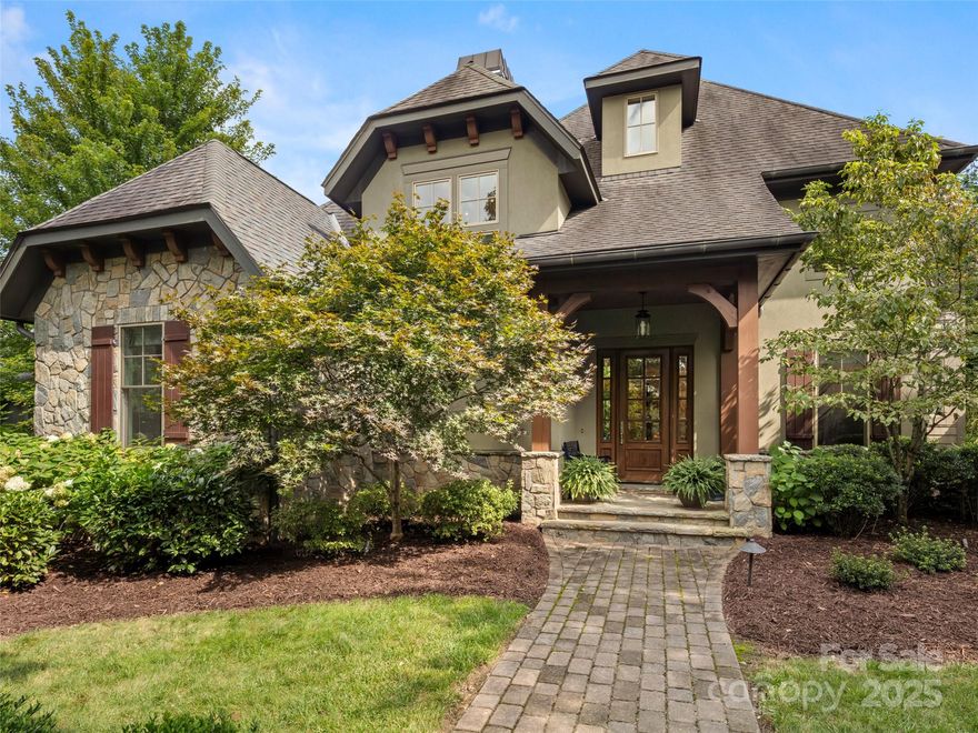 Impeccably maintained and brimming with timeless style, this Walnut Cove residence offers an extraordinary opportunity, delivering refined craftsmanship, thoughtful design, and a lifestyle of ease.

At the heart of the home, the great room and kitchen merge seamlessly, creating an inviting setting for both intimate evenings and enjoyable entertaining. The main level features an open floor plan, a serene primary suite with spacious spa inspired primary bath, and a screened flagstone porch where you can savor sunny days, quiet moments and mountain breezes. The bright kitchen features a corner window, Thermador appliances, an impressive granite island with ample storage and a large pantry.  Natural light streams into the nearby laundry room with granite counters for folding clothes, a large utility sink, custom cabinetry and space for hanging clothes to dry.  Upstairs, two en suite guest retreats promise comfort and solitude, while a versatile bonus room is perfectly suited for a home office, media lounge, or additional guest quarters.

Uniquely positioned on the homesite, this property offers protected front and rear views framed by vibrant landscaping and a fully fenced backyard - an artful blend of color, privacy, and natural beauty. 

Just beyond your door, rejuvenation awaits at the community’s state-of-the-art Wellness and Tennis Center or schedule a round of golf at the world-class Jack Nicklaus Signature Golf Course. Spend an evening dining with friends at the community Tavern or participate in a host of social and recreational amenities designed to elevate every day. Membership is available that offers access to golf at all 7 Cliffs Communities. Conveniently located between Asheville and Hendersonville, the beautiful Blue Ridge Parkway, and just 7 miles from Asheville Airport; you are close to restaurants, shopping, and a variety of outdoor activities. Come be a part of this vibrant mountain community that is ready to welcome you home!