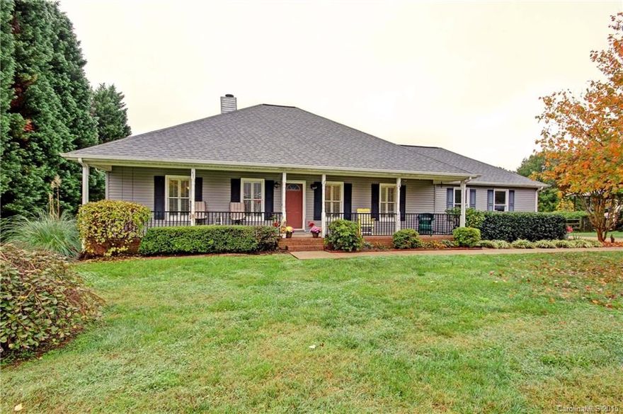 Ranch with rocking chair front porch in the hot spot of Mooresville. Golf course fairway view with view to the greens! Scr. Porch, large wood deck, split rail fence, 2-car side load garage with extra bump out for storage. Split bedroom plan with very large secondary bedrooms. Open floor plan concept with no wasted space and plenty of natural light. Everyone wants a one-level in a beautiful tree-lined street with no through traffic. New roof in 2009!