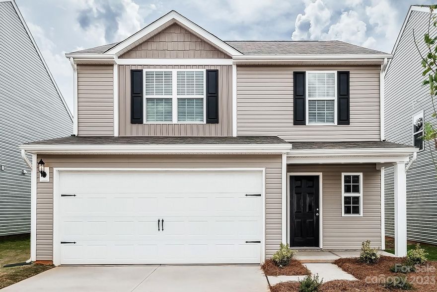 This 4-bed home has a spacious and airy feel that has been designed with your needs in mind. The large kitchen is open to the dining area and living room and has stainless steel appliances, gorgeous granite countertops, 36” upper cabinets with brushed nickel hardware and a large island. The master is tucked away on the second floor of the home with plenty of natural light and a fabulous master bath. In the master bath you will find a large vanity, great storage and an impressive walk-in closet.