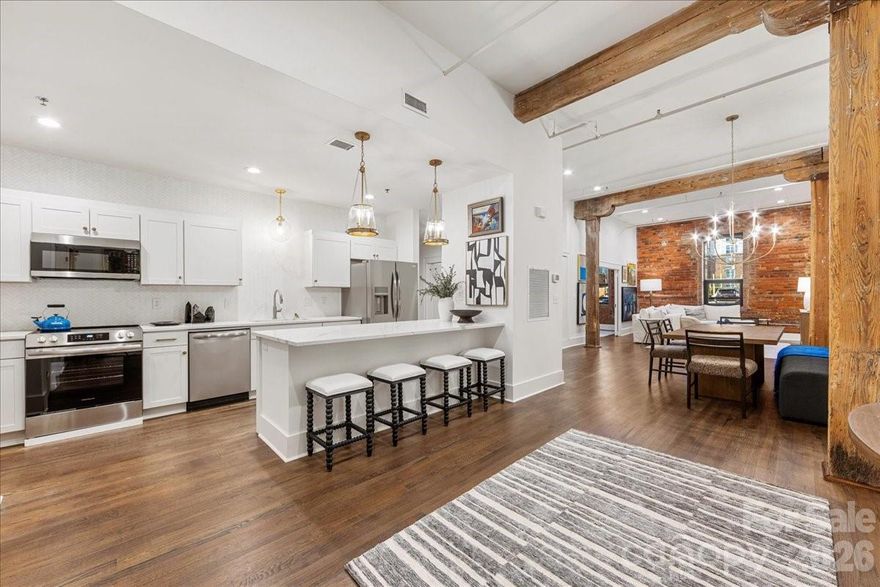Work/Live in a Chic, Historic, and Exceptionally Rare unit — A True South End Gem!

Welcome to an extraordinary, designer-renovated property in Factory Lofts, one of Charlotte’s most iconic and coveted buildings—formerly the historic Lance Cracker Factory and now home to just 50 exclusive offices/homes. Set in the heart of South End, Charlotte’s hottest and most dynamic neighborhood, this home blends industrial heritage with refined, designer-level sophistication. Perfect for interior designers, attorneys, artists, you name it! #217 is currently set up as a one-bedroom plus office space, this unit was gut-renovated by an internationally known interior designer as her personal residence, resulting in a level of craftsmanship and finish rarely seen in the market. Soaring 15' ceilings, refinished hardwood floors, a stunning Thassos marble backsplash in the kitchen, and a Carrara marble bathroom countertop set a timeless, elevated tone throughout. Thoughtfully designed custom closets maximize storage, while curated lighting by Visual Comfort adds warmth and architectural drama. The loft-like layout offers exceptional versatility—perfect as a primary residence, pied-à-terre, or income-producing investment. Even more rare, Factory Lofts is one of Charlotte’s only true LIVE/WORK buildings, allowing you to operate a boutique business, studio, or office directly from the unit. Additional highlights include gated parking, separate storage, and abundant original factory details that celebrate the building’s historic character.