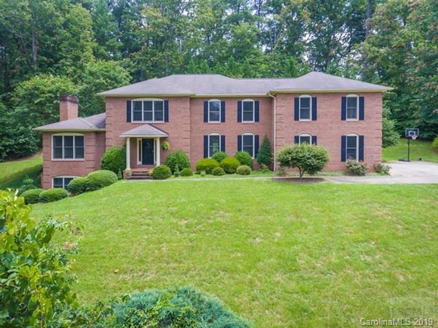 Elegant brick home on double lot offers lots of space for family and entertaining friends.  Newly refinished wood floors, carpet and paint, updated kitchen and large rooms make this the perfect family home.  Fully finished basement with fireplace, wet bar, billiards area and home gym.  Large master suite upstairs along with 3 more bedrooms and a nursery/office space next to Master.  This home is a must see!