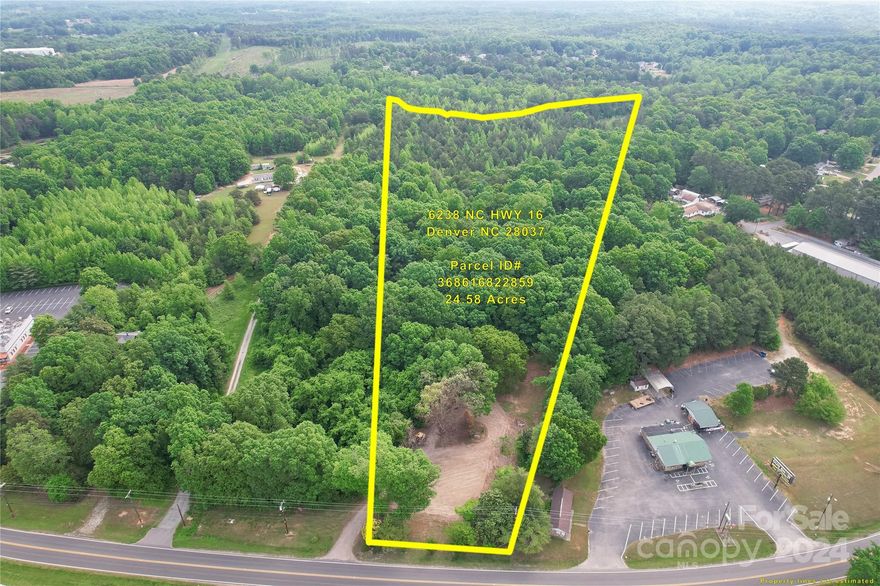 24+ Acres with approximately 150 ft of road frontage on HWY 16 in Denver. Currently zoned R-40 & backs up to established custom home neighborhood. Neighboring commercial properties are also for sale (Parcel # 368615627595 & 368619629384). Endless possibilities. Great location off Hwy 16 with easy access to HWY 150.