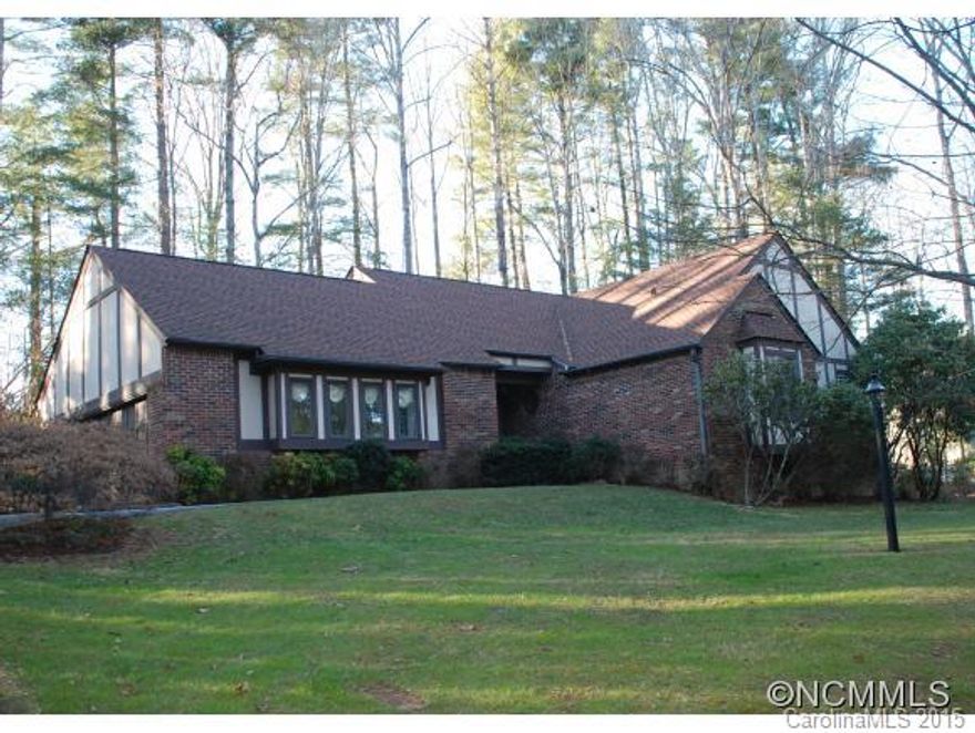 Beautiful Tudor ranch with basement on a wooded lot in desirable Winding Way Estates, just minutes from downtown Hendersonville.  This spacious home has a cathedral ceiling and wood burning fireplace in the great room and an open layout perfect for entertaining. The home has been freshly painted throughout and is move in ready. Make a few minor updates to suit your personal style. Abundant storage throughout. Large den and wood stove downstairs.