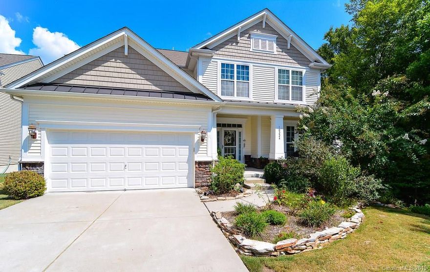 Hardwood floors throughout!! Private backyard, fenced, with a pool and playground area. Deck for entertaining and patio. Side buffer of trees surrounding right side of home and backyard. Finished basement with bar and plenty of space for in-law suite, bonus room, entertaining area. Main floor has granite counters, gas log fireplace, bedroom and full bath, dining room, breakfast nook, great room. Upstairs are three addtl bedrooms and a large bonus room. This home is a gem! Ready for move in!