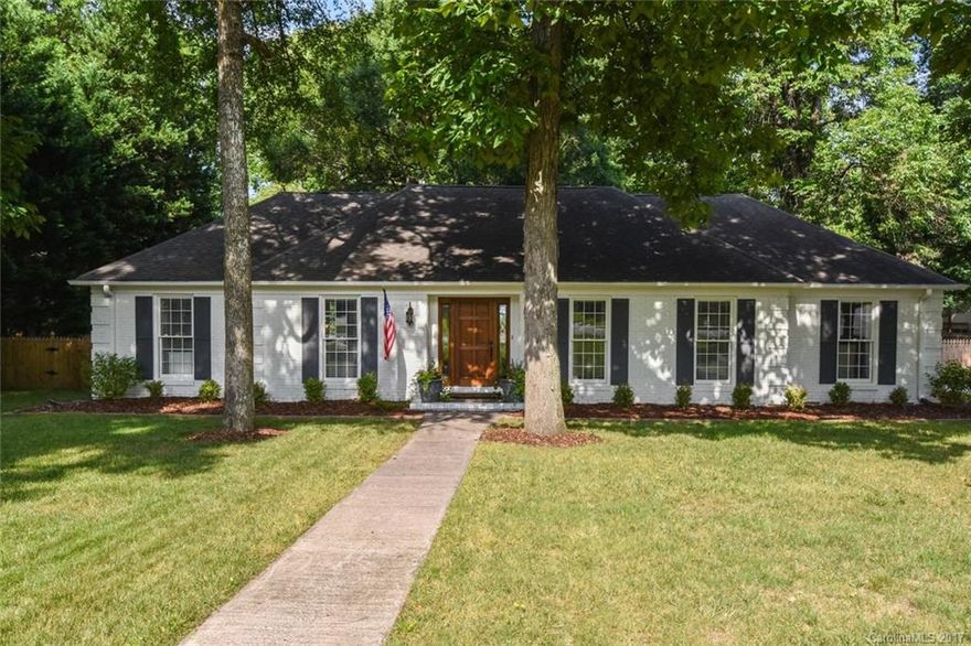 Picturesque brick ranch renovated in 2014. Gorgeous white kitchen w/ custom inlay cabinetry, SS appliances, gas range & spacious island. Kitchen opens to den w/ fireplace. Large master boasts lg closet & beautiful renovated bath w/ marble tile & double vanities. Hdwds throughout. Utility room provides a side entryway from the driveway. Covered, screened-in porch overlooks lush, green bkyd w/ new storage shed. Lot is completely fenced in & private. Don't miss this extremely special home!