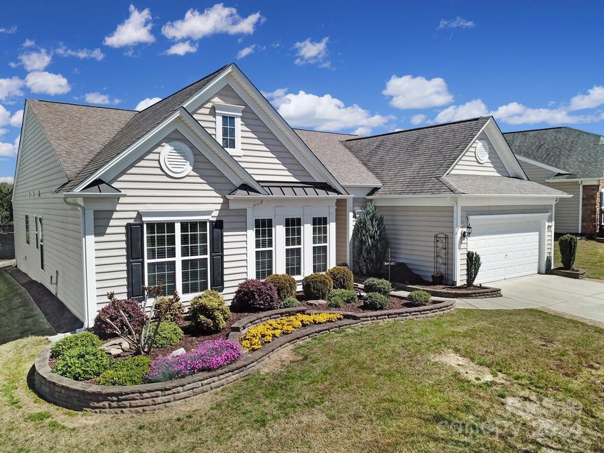 Gorgeous & sought after Crestwood Meadow home in beautiful 55+ Amenity rich community of Sun City Carolina Lakes. This meticulously maintained 3 BR/2.5 BA, + office, WOWS from the minute you pull into the driveway. Open floorplan loaded w/crown moldings & gleaming hardwood floors extends thru main living areas. Bright UPDATED chef's kitchen features large island, roll-out cabinets, quartz countertops, custom tile backsplash, ss appliances, built-in desk & eat-in breakfast area. Spacious Primary Suite w/trey ceiling, walk-in closet & updated ensuite bath w/walk-in shower & soaking tub is divine. Two nice size secondary bedrooms, hall bath & office w/french doors sit in the front of the home. Enjoy entertaining & relaxing in your private 3-season room, just off the kitchen & living room w/add'l extended paver patio, including gas line for grill. Conveniently located to shopping, grocery, restaurants, medical & more, all accessible by golf cart. Low SC Taxes! This is a "Must See" home!