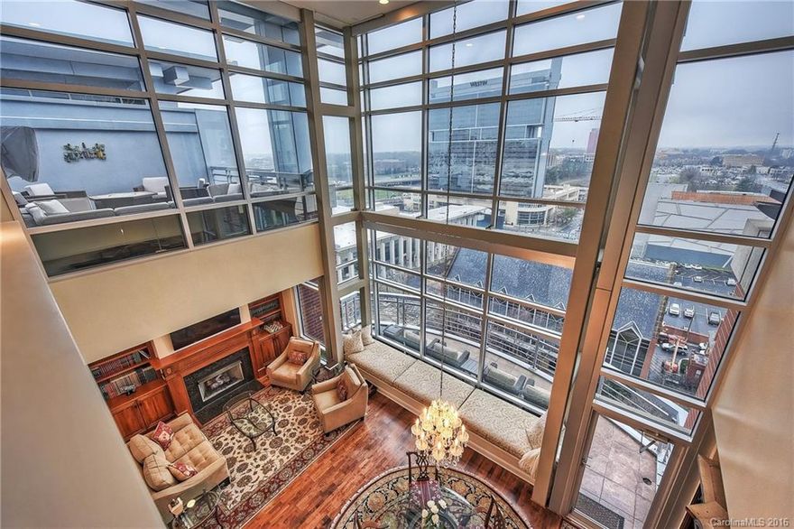 The ultimate in location and gracious indoor/outdoor living space. Penthouse boasts stunning views over the "The Green." Soaring 25 ft wall of windows bring the energy of the city into the space. Main floor owner's suite. Completely remodeled luxury bath and sizable walk-in closet/built-ins. Gourmet kitchen, gas cooking, wall ovens, granite c-tops/island, wine fridge, butler's pantry w/ wet bar. Massive/private rooftop terrace is perfect for lounging, sipping and entertaining.