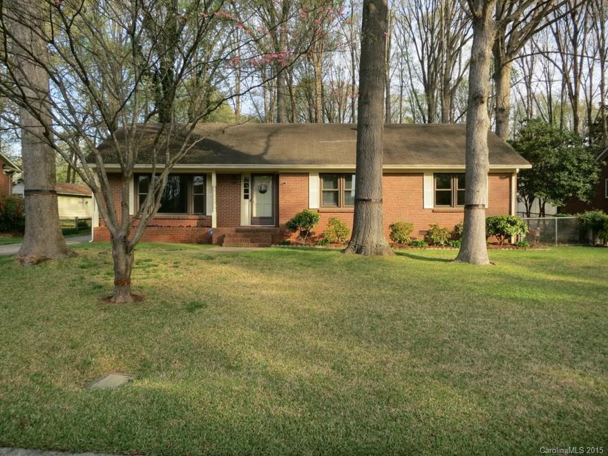 Charming all brick ranch that has been owned by one owner since 1969. Immaculately maintained & improved with fresh paint throughout, hardwood floors in bedrooms, new carpet in living areas, freshly stained kitchen cabinets. New windows throughout. Sets on a beautiful wooded lot with huge oak trees, beautifully landscaped. The fenced in back yard hosts a 14-16, 15ft ceiling all electric storage shed & second full-electric workshop. Ceiling fans, french doors, deck, a must see. Won't last long!