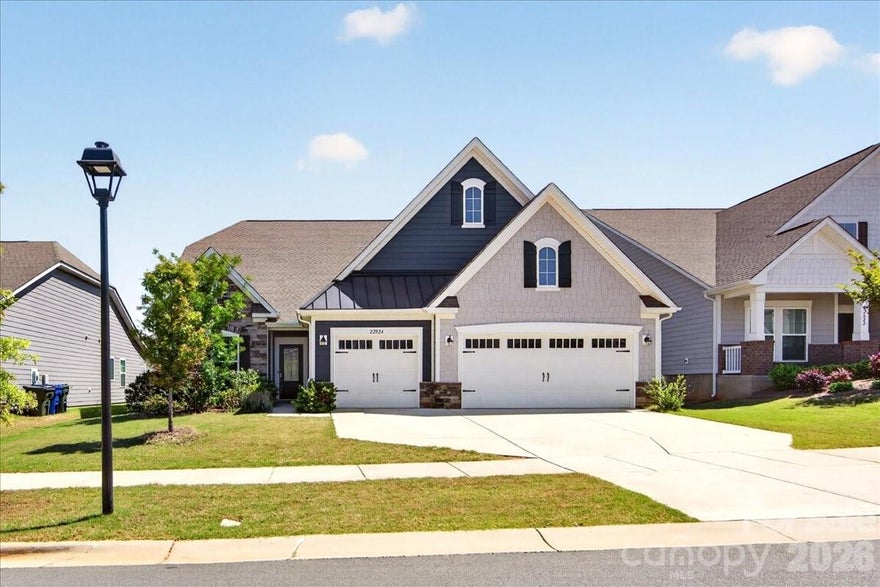 Prepare to by wowed by this beautiful home that provides space and functionality for both everyday living and entertaining.  With 4 bedrooms, 3.5 baths, a dedicated den/office, bonus room, and 3 car garage, the flexibility in this floor plan can be tailored to fit. The heart of the first floor is the large open kitchen with an expansive island, gas cooktop and double ovens.  The primary suite boasts an incredible walk in closet, split vanities and oversized shower.  Enjoy relaxing on the covered back porch which overlooks the fenced yard and backs up to neighborhood green space.  Conveniently located to 1-77, Birkdale, Lake Norman, Northstone Country Club and a host of shops and restaurants.