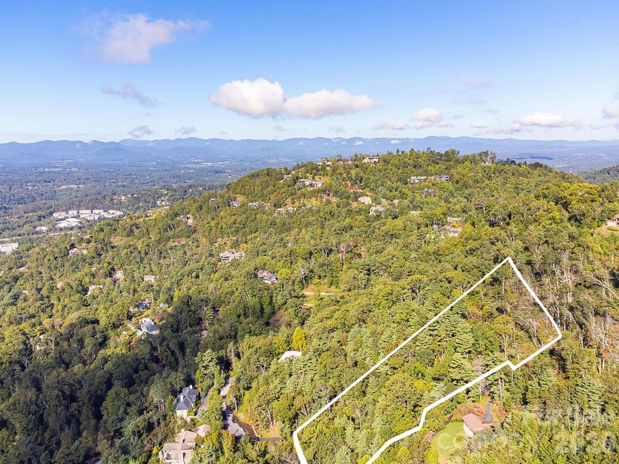 Wooded estate lot in North Asheville with 1.54 acres, creating a private oasis to build your dream home. Minutes to all North Asheville amenties, Beaver Lake, Grove Park Inn and more.