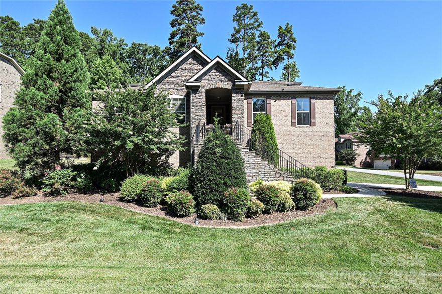Gorgeous brick and stone home on corner lot in desired Treetops at Cowan's Ford neighborhood. This lovely home has it all!  Features include Primary bedroom and ensuite bath on main, 2 additional main floor bedrooms and another full bath, office with french doors, spacious dining area, fireplace with gas logs, gourmet kitchen with over-sized island and lots of cabinets, stainless steel appliances with gas cooktop and micowave/oven wall combo, granite counters, tile backsplash, gorgeous wood floors throughout most of the home, screened porch, fenced yard, mud room/drop zone, full laundry room with sink, upstairs suite which includes bedroom, full bath and living area/bonus room....perfect for guests!, irrigation system, very tall crawl space makes for exceptional extra storage!  This home is so convenient to Birkdale village shopping and dining and restaurants and shopping in Denver.  Low Lincoln county taxes!  Cowan's Ford Country Club offers golf, swimming, tennis, and lake access