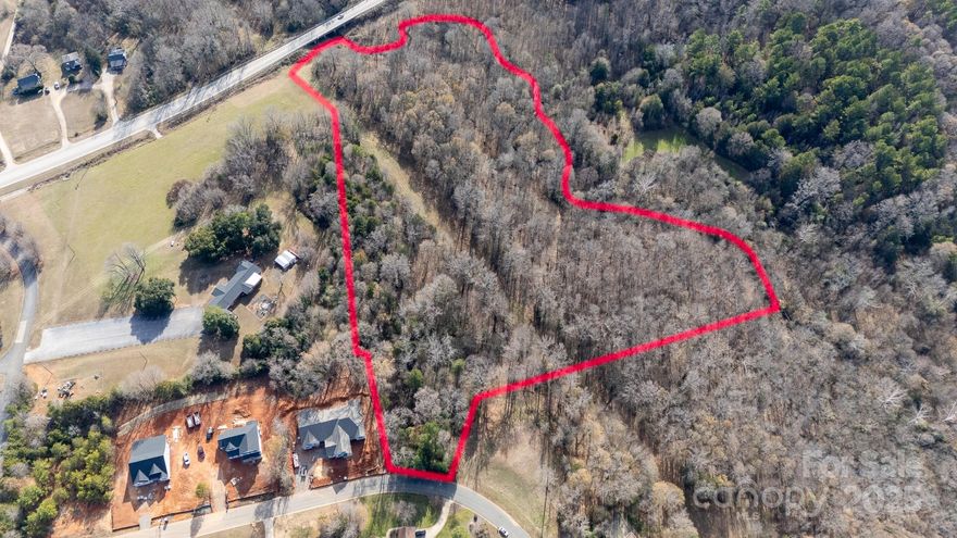 Build your dream home on this expansive 12.17 acre tract located on Farrow Road.  This unique property offers the perfect balance of sprawling acreage, natural water features, and the freedom of minimal restrictions.  The property features several buildable acres (approximately 3.1) with the back acreage serving as your own private park featuring a tranquil winding creek.  While this portion sits within a flood plain, it ensures permanent privacy and a stunning natural backdrop.  To maintain the area's aesthetics and property values, building requirements exist but are minimal.  A newly constructed home must have a minimum of 2400 sq. ft. of living space with a side or rear-load garage.  This Farrow Road property offers a rare opportunity to own significant acreage in a convenient residential setting.