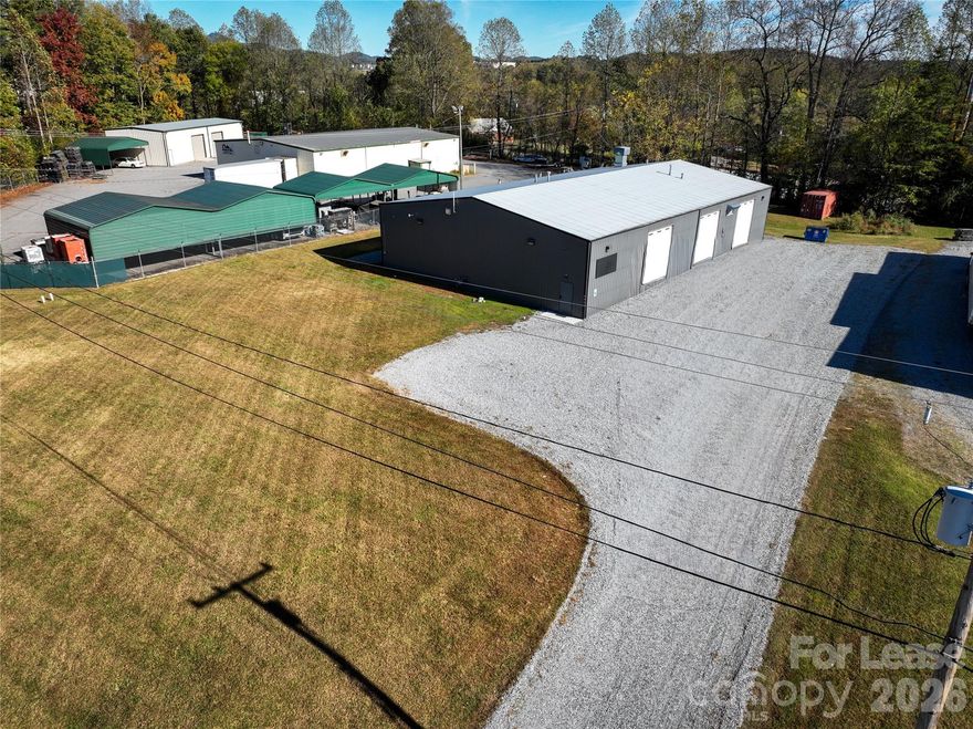 Well-maintained 6,741 SF freestanding industrial building ideal for light manufacturing, auto-related, or service-trade users. The building features a clear-span layout, four drive-in doors, and a small finished office area. A professional-grade paint spray booth remains in place from the property’s prior use as an auto body facility, offering turnkey potential for similar operations or flexible adaptation for other industrial users. Located just off US-321, the site provides excellent access to Hickory, Morganton, and the broader area market. The property’s gravel drive and open yard area allow for easy truck circulation, parking, and limited outdoor storage.