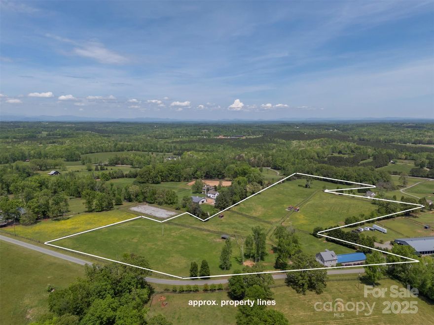 Located on the CETA Trail System: Nestled in the heart of one of America's premier equestrian communities, this exceptional 20-acre property is a true haven for horse lovers. The land is fully fenced and divided into seven pastures, with gently rolling terrain. Multiple prime home sites offer the potential to build your dream residence. A standout feature of the property is the European-style barn, which includes a beautifully renovated 2-bedroom, 1,814 sq ft apartment above. The apartment boasts a new deck with sweeping views of the pastures, along with recent upgrades throughout: new windows, roof, siding, heating system, fresh paint, etc. The barn is fully equipped with a heated tack and feed room, wash stall, and a half bath. Each paddock is serviced by water from a high-quality well. There are no restrictions on the types of animals allowed. The barn’s design even allows for conversion into a garage, workshop, or artist’s studio. Fiber-optic internet. The owner is a NC broker.