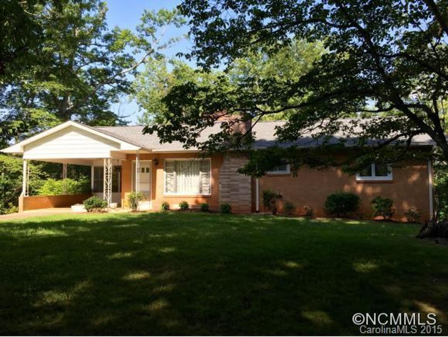 Set on a very slight knoll sprinkled with old-growth trees, this 1 story home offers 2 large BR and 1 full BA. It includes a formal living room with brick fireplace, a dining area/den with second fireplace and overlooking the rear yard and mountain views, a bright eat-in kitchen, and a screened porch off the carport. The home also has a full unfinished basement.  The true highlight of this estate is the +/- 4.4 acres that has great views.