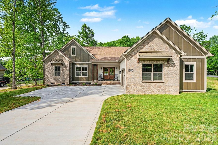 Welcome to 4527 Burrenfort Dr, Denver, NC 28037 - stunning new construction by Mike Palmer Homes, completed in 2025! This 3-bedroom, 2-bath home with a bonus room offers 2,032 square feet of thoughtfully designed living space on a spacious 0.62-acre lot. Flexible floor plan includes a bonus room with French doors and a closet - ideal as a 4th bedroom, home office, or flex space. Open-concept layout features a bright living area flowing into a chef’s kitchen with quartz countertops, a large center island, a gas range, and top-of-the-line stainless steel appliances. Private primary suite with direct access to the enclosed porch. Spa-like primary bath includes a freestanding soaking tub, an oversized walk-in shower with marble walls, and tile flooring. Enjoy outdoor living in the fenced backyard, which features an enclosed porch accessible from both the dining area and primary suite - perfect for relaxing or entertaining.