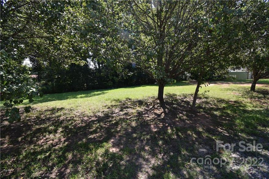 Nice partly cleared lot just outside City Limits. Great location for your new home, double wide or modular home. No City Taxes!