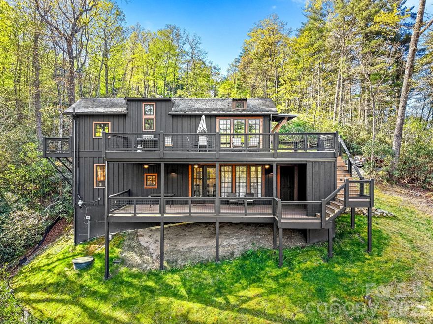 Priced BELOW tax value = instant equity opportunity you don’t want to miss.

Why buy one when you can get two units for the price of one?

Welcome to a Jeffrey Dungan Low Country XL-designed mountain Tiny cottage where views of Whiteside Mountain don’t get any better. This is the kind of setting people chase in the mountains—and rarely find paired with this level of design and versatility. 

Located in the Gated Community of The Preserve at Whiteside Cliffs. The upper level lives like a modern designer home, featuring Summit appliances, quartz countertops, Delta fixtures, and 7” oak hardwood flooring. Soaring cathedral ceilings and 270° panoramic views flood the space with natural light through expansive Ply Gem energy-efficient windows and French doors. Both bedrooms accommodates a king bed, includes full-height closet storage, and a built-in desk. Plus, enjoy your private deck just outside your Main floor Bedroom.

Downstairs offers a fully functional second living space with its own living area, kitchenette, bedroom, and walk-in shower—making this a true dual-unit setup ideal for guests, rental income, or multi-generational living. With its own covered deck with views that don't disappoint.

Stay comfortable year-round with dual Mitsubishi mini-splits (one per level).

Outdoor living is where this property really shines and expands your Tiny Home living space:
~ Over 500 sq ft of upper-level decking to soak in those unmatched Whiteside Mountain views
~ Private deck off the primary bedroom
~ Covered lower-level deck with ceiling fans for relaxed, all-season use

Additional features include:
~ Premium Board and Batten Cedar siding  
~ Shiplap Interior Walls
~ Built-in breakfast bar dining
~ Combo washer/dryer
~ Two dry storage areas
~ Energy-efficient construction throughout
~ Sleeps 4+ comfortably 

This is more than a mountain getaway—it’s a smart investment priced under tax value with built-in upside from day one. Whether you’re looking for a mountain escape, short-term rental potential, or multi-generational living, this property checks every box. If you’ve been waiting for a property where the view truly delivers—this is it. Opportunities like this—priced under tax value with dual living spaces—don’t sit long. Call and visit the Black Panther TODAY!