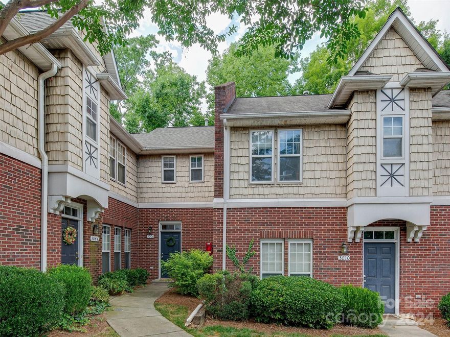 Hard to find 3 bedroom condo so close to it all! This charming European styled two story home boasts newer luxury vinyl wood look floors on the main level as well as new appliances! The primary suite could be up OR down with this great layout. The lower level suite has a large walk in and en suite bath complete with garden tub!  Upstairs are two great bedrooms and a shared bath. The large and bright kitchen is sure to impress and you can't beat the layout. The quiet patio is a wonderful place to unwind or enjoy the evening while feeling like you are in your own private space or entertaining friends! The 2 story vaulted living room is HUGE and has a cozy gas fireplace for cool evenings and great ambiance! This home is tucked away perfectly and great for entertaining. The location off the first exit of Independence makes getting around town a breeze. Bojangles Arena, Harris Teeter grocery and all the new and fun Midwood parks, bars, breweries and restaurants are all around the corner!