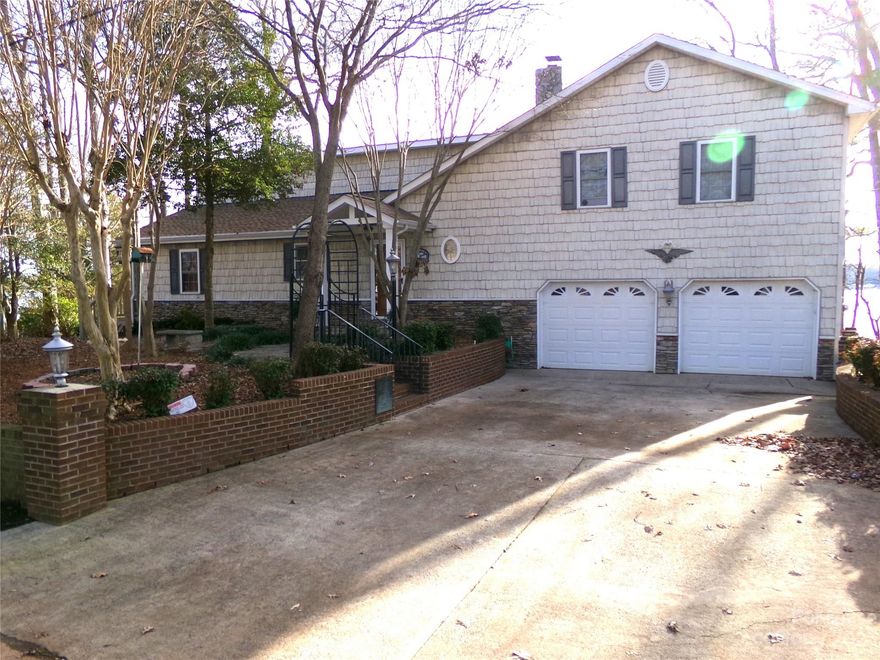 ON THE WATERFRONT WITH MILES OF LAKE VIEWS, AND SUNSET VIEWS SECOND TO NONE.  This beautifully appointed and furnished home is nestled on the waterfront at Lake Tillery.  It is located on the southernmost peninsula of Emerald Shores.  The warm and inviting interior atmosphere of the home offers a life style of peaceful enjoyment, unimpeded views of Lake Tillery and easy access to lakefront entertainment.  Yes, bring your boat, the deck chairs and the floats.  Lounge on the newly refurbished and covered boat dock and get some sun.  Come use the enclosed boathouse with lift for your bass or ski boat.  One of the widest points on Lake Tillery is in your backyard and fishing is GOOD.  It is not often that you can lease a wonderful lake retreat.  Lease term is one year minimum, all furnishings and appliances included.  Apply TODAY.  GET APPROVED, PACK YOU SUITECASE AND COME AND ENJOY.  Pets conditional breed & temperament. Nonrefundable pet fee $250.00; pet rent 3% of rent amount per pet.