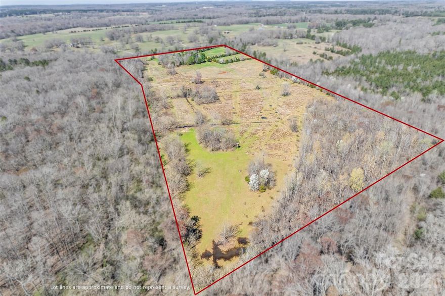 Prime vacant land- approximately 52.79 fenced deeded acres. A rare picturesque land that offers a tranquil blend of rolling pasture and mature woods. RUD zoning with an impressive road frontage of approximately 1,100 feet. There is potential to subdivide and build multiple homes, create a private estate, or farm. Serene Fishing Creek is along one side of the property. Whether your envisioning a homestead with horses or a retreat, this stunning countryside will certainly catch your eye.