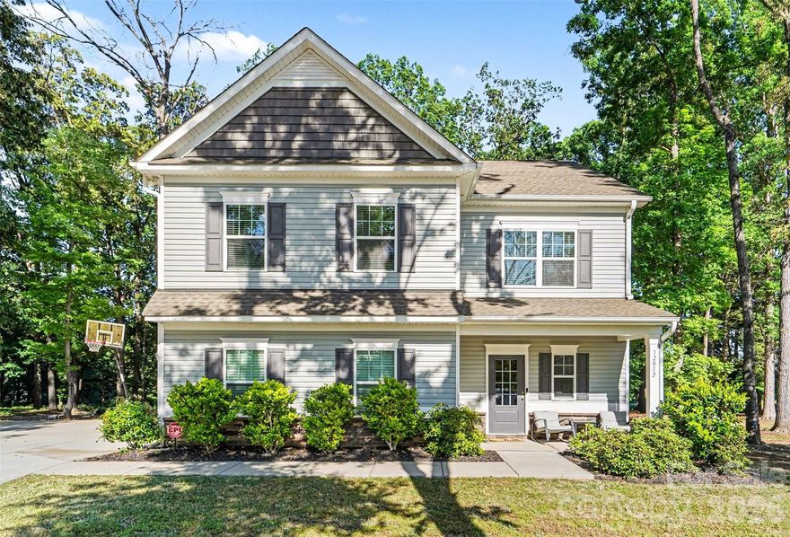 Welcome to 12012 Saddle Back Trail in the beautiful Stanly Farms community of Stanfield. This thoughtfully upgraded home seamlessly blends comfort, style, and functionality. Situated on a private wooded lot just under one acre, this property offers the perfect balance of space, privacy, and upscale living.

Inside, you’ll find elegant finishes throughout, including durable LVP flooring, tile, vinyl, and plush carpet upstairs for added warmth and comfort. The kitchen is designed to impress with stunning quartz countertops, 42” soft-close cabinets, crown molding, and abundant prep and storage space ideal for entertaining or everyday living. Wainscoting accents and crown molding throughout the first floor add timeless character and sophistication.

The spacious primary suite serves as a private retreat featuring a tray ceiling, cozy sitting area, walk-in closet, and a luxurious full tile shower and separate soaking tub. Both bathrooms include dual vanities, providing style and convenience for daily routines.

Step outside to an oversized patio and custom outdoor fireplace where you can relax under the stars and enjoy a true backyard escape. The expansive entertainment area offers endless possibilities — perfect for creating a breathtaking outdoor kitchen, gathering space, or your dream outdoor oasis. An extended driveway and side-load 2-car garage add convenience while enhancing curb appeal.

Located in desirable Stanly Farms, this home combines modern upgrades, peaceful wooded surroundings, and exceptional indoor-outdoor living designed to fit any lifestyle.