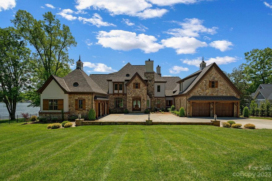 This Gorgeous stunner was awarded Best of the Lake 2022. Private gated home on over an acre of land. Magnificent custom home was completed in 2020. Chef's kitchen with Wolf appliances, Sub zero, walk in pantry with second fridge, massive island with eat in breakfast area. Primary suite on the main level with luxury bathroom featuring wall towel warmer, radiant floor heating, ceiling heater and programable shower jets. Four well appointed guest suites on the upper level. Billard/Bonus room with bar area. Theatre room with extraordinary surround sound system. Superb heated infinity pool and spa. Extensive Savant smart home system that controls the entire home from your phone (or 3 inwall mounted iPads): lights, TV's, surround sound, security, etc. Even the garages are impressive in this home with hvac, speakers, TV's, storage and full golf simulator in one of the bays! Grandfathered 60 ft boat ramp. Lovely dock with boat and jet ski lifts. See the feature sheet for all of the specifics!