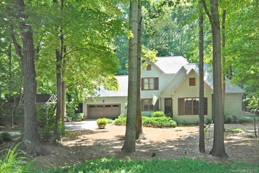 Tranquility, Quality, Character. What a find!! Beautiful home in quiet wooded setting. Rich hardwood floors, stunning stonework throughout, and so many upgrades and updates completed by contractor/owner. Master on main. Kitchen has gorgeous granite, stainless appliances, travertine floors and backsplash, and large pantry. Built-ins in family room and library. Upstairs has loft office space, bonus room, and 2 BR with Jack and Jill bath. Back deck with stone oven fireplace is quite the oasis.