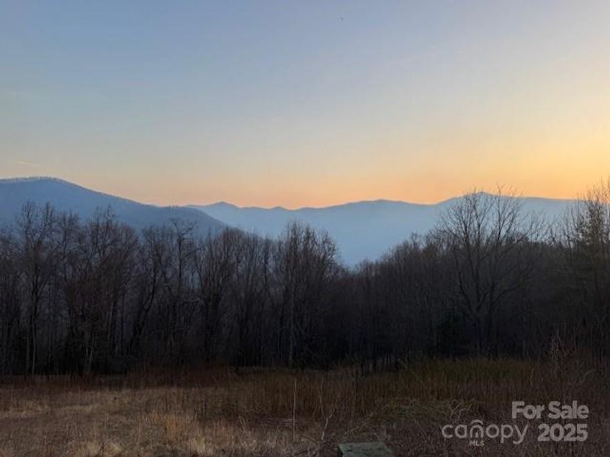 Incredible opportunity to own a unique property with 180 degree long range mountain views, adjoining thousands of government owned wildlife refuge, underground utilities and quiet solitude.  Located in the Sunburst area, close to Cold Mountain and close to the Daniel Boone Boy Scout Camp.  Don't want to see the lights of other houses or lights of traffic on nearby roads?  This is your prooperty!  Just above this property by an easy half mile drive by car, jeep or atv via Forest Service road are acres of cleared wildlife habitat with incrdible 360 degree views of Cold Mountain, Sunburst, Shining Rock and the Blue Ridge Mountains of Haywood County.