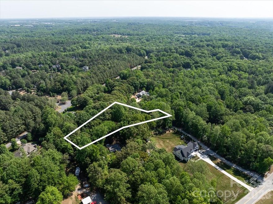 1.5-acre lot in desirable Fort Mill with a private setting and no HOA. Great opportunity to build with added flexibility. Showings by appointment with an agent only.