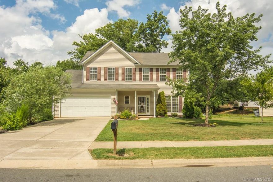 This home resides in an established neighborhood and features an open floor plan. It has a spacious kitchen with granite countertops, great appliances and custom cabinets. New HVAC. Formal Dining Room with Brazilian Cherry flooring. Large wooded yard overlooks small serene stream. Landscaping has been meticulously manicured. Hot and Cold Water in the Garage. Close to I-485, 29 / 49, UNCC, Harrisburg, shops and more! Seller is offering a 13 month Home Warranties of America warranty.