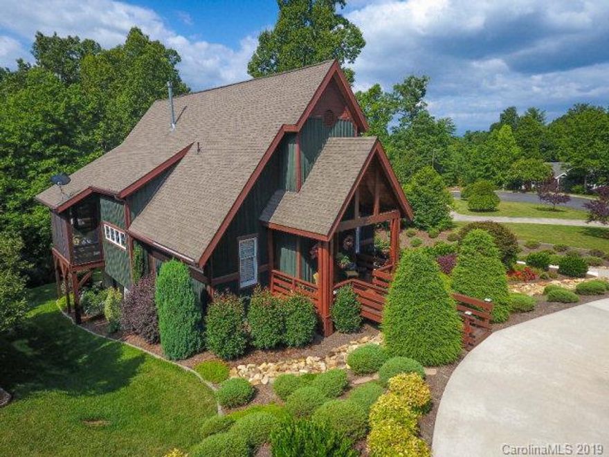 Cottonwood Builders custom board and batten lake home.Upgraded features throughout including all mahogany doors, slate surround fireplace with built ins, cathedral ceilings, Oak Hill Iron railings and entry hooks, double screened porches, subway tiled & granite baths, large pantry/laundry and flex room for extra guest space, office or den. Private main level master with open living/dining great room. Kitchen had soapstone counters with SS appliances. Large pantry with laundry and access to half bath. hardwood floors throughout upper and lower living areas and new carpet in lower bedrooms. Lower level has 2 bedrooms that share a jack and jill office space and spacious hall bath with custom cabinetry. Spacious 2 car garage with extra storage areas and built in cabinetry. Beautifully landscaped 1 acre lot with irrigation system