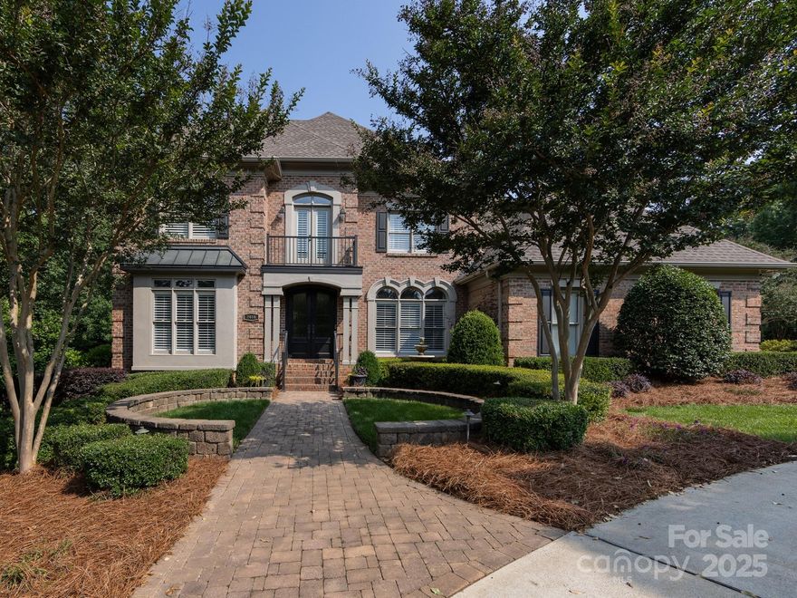 Beautifully renovated and meticulously maintained 5 bedroom/4.1 bath custom brick two-story home situated on a lush corner lot with circular driveway, just minutes from SouthPark! Amazing features include 10’ ceilings down/9'ceilings up, two fireplaces and abundant windows with plantation shutters. Inviting living room with wall of built ins. Two story great room opens to breakfast room and chef’s kitchen with custom cabinetry, subway tile backsplash with pot filler, professional Thermador SS appliances and wide center island. Main level primary suite has large custom closet, luxurious bath with dual vanities, walk-in shower and relaxing soaking tub. Upper level has four bedrooms with large closets and direct bath access. Huge walk-in attic storage. Incredible lower level has stone gas fireplace, kitchenette & full bath. Media/bonus room with flex space for billiards and exercise.  The upper deck and lower brick terrace offer two spots for relaxing~ Don’t miss this move-in ready home!