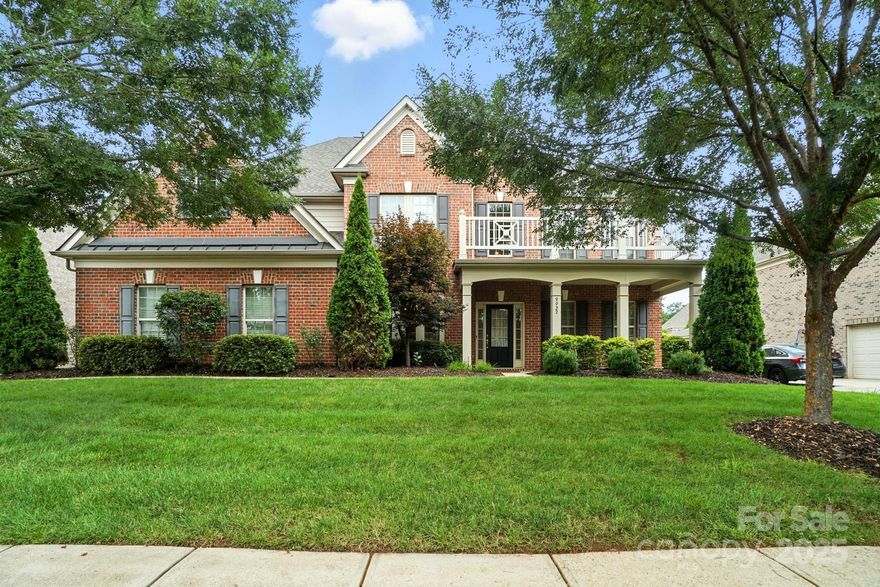 Meticulously cared for 6 bedroom 5 bath brick home with 2 garages and a custom outdoor kitchen/dining area with half bath in South Charlotte's desirable Ballanmoor neighborhood.  Features include 2 garages (1 bay, 2 bay) with epoxy floors and storage shelving, gleaming wood floors on main level, new quartz counter tops and new gas cook top in kitchen, spacious morning room off kitchen, one bedroom and full bath on main floor, surround sound wired in living room and primary bedroom, 2 story foyer, large laundry with sink, large primary suite with walk-in closet and custom cabinets in bath, house hardwired for internet access, 3rd floor with multipurpose bedroom/bonus room and full bathroom, walk-in attic storage, custom built outdoor living/dining area with sink and half bathroom, new HVAC for 2nd floor, fenced yard, large brick-paver patio, all located close to schools, retail, and restaurants in Blakeney, Ballantyne, and all that South Charlotte has to offer.