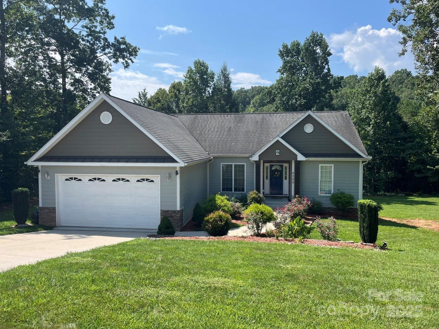 Welcome to 2302 Saratoga Run, a 3-bedroom, 2-bath home with over 1,700 sq ft PLUS full basement in one of Morganton’s most inviting neighborhoods!  Completed in 2015, this home offers a bright, open layout with a spacious living area that flows into the kitchen and dining space.  The primary suite features its own bath, while two additional bedrooms provide flexibility for family, guests, or office use.  Outside, enjoy a private backyard with room to relax, garden, or play, and the adjacent wooded lot is seller-owned and is included in the sale.  Conveniently located near downtown Morganton, Lake James, schools, and outdoor recreation, this property balances comfort, convenience, and charm.